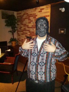 In a gorilla mask. 